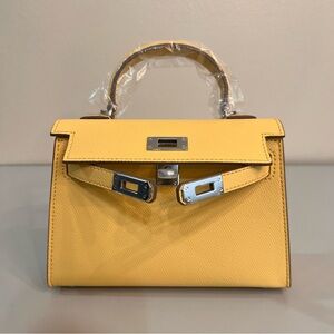 Genuine Epsom Leather mini handbag with shoulder strap featuring Silver hardware